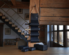 Încărcați imaginea în vizualizatorul Galeriei, Handmade black leather wine bottle holder with a space for multiple bottles, displayed alongside a tissue box cover and additional leather pieces.
