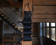Încărcați imaginea în vizualizatorul Galeriei, Handmade black leather wine bottle holder with a space for multiple bottles, displayed alongside a tissue box cover and additional leather pieces.
