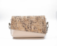 Încărcați imaginea în vizualizatorul Galeriei, Crossbody bag with snake print top half and beige bottom half on a white background
